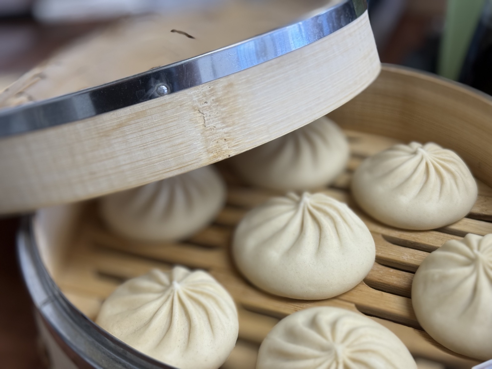 Bao buns in a bamboo steamer